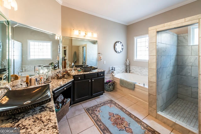 bathroom featuring plus walk in shower, vanity, tile patterned floors, and ornamental molding