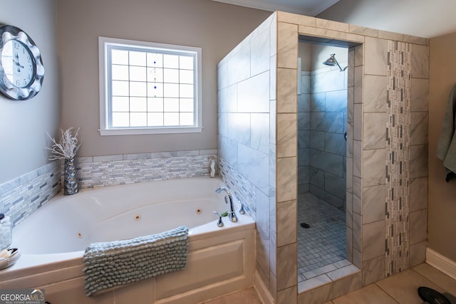 bathroom featuring plus walk in shower and tile patterned flooring