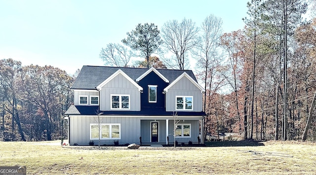 view of front of property featuring a porch and a front yard