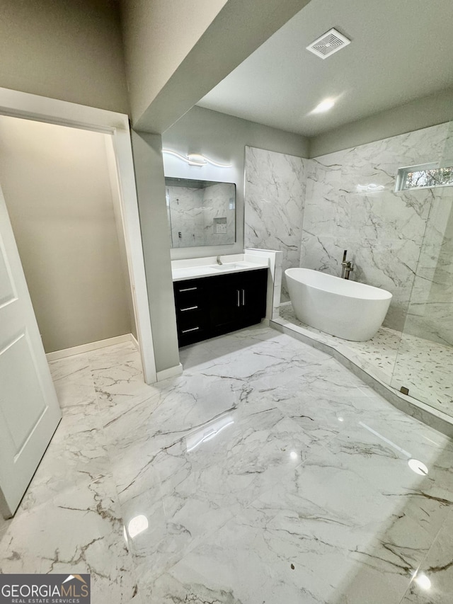 bathroom featuring a bath and vanity