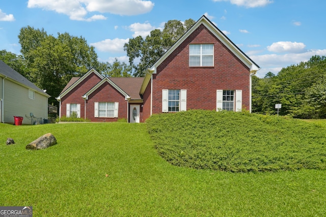 front facade with a front lawn