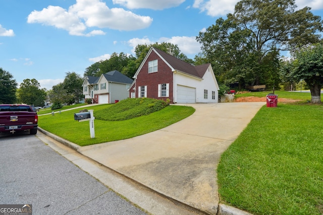 view of side of property with a yard and a garage