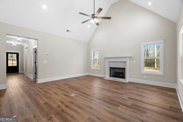 unfurnished living room featuring vaulted ceiling