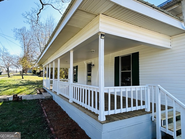 view of side of home featuring a yard