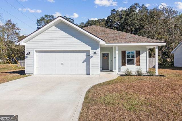 ranch-style house featuring a front yard, a garage, and a porch