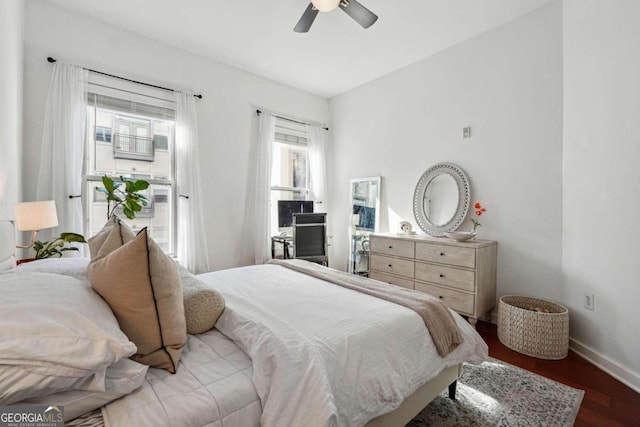 bedroom featuring ceiling fan and dark hardwood / wood-style flooring