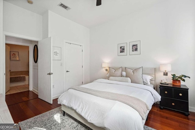 bedroom featuring ceiling fan and dark wood-type flooring