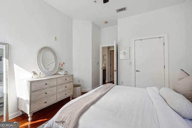 bedroom featuring dark hardwood / wood-style flooring