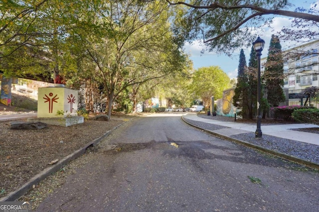 view of road featuring curbs and sidewalks