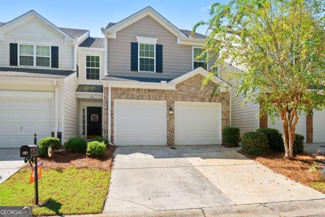 townhome / multi-family property featuring a garage