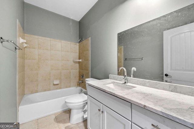 full bathroom with tile patterned flooring, vanity, toilet, and tiled shower / bath