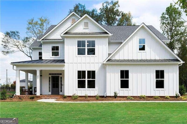 modern inspired farmhouse with covered porch and a front yard