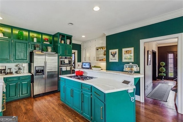 kitchen featuring dark hardwood / wood-style flooring, a center island, stainless steel appliances, and ornamental molding