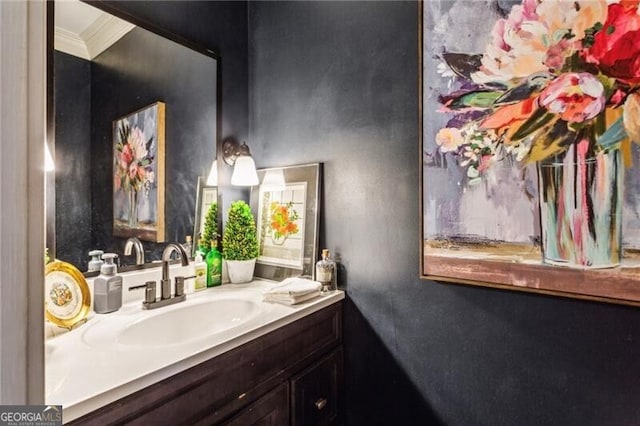 bathroom with vanity and ornamental molding