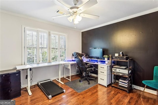 office area featuring ceiling fan, ornamental molding, and dark hardwood / wood-style floors