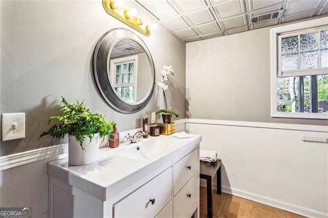 bathroom featuring tile patterned flooring and vanity