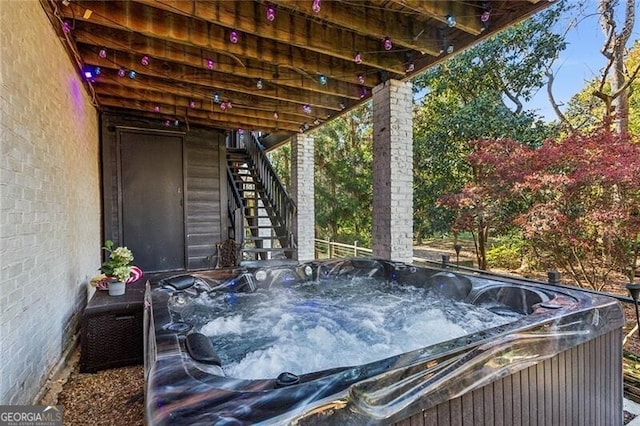 exterior space with a hot tub