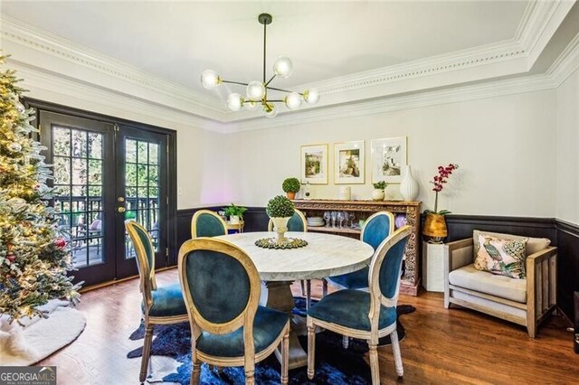 living room with a wealth of natural light, ornamental molding, hardwood / wood-style floors, and a fireplace