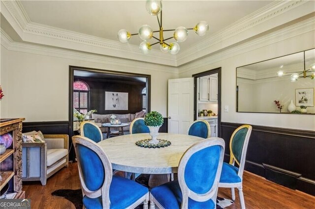 dining area with a chandelier, dark hardwood / wood-style floors, crown molding, and french doors