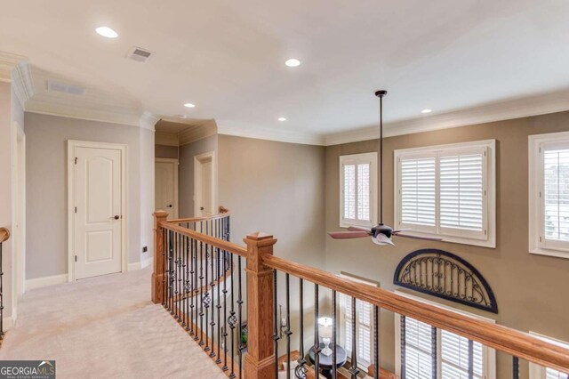 corridor with light carpet and ornamental molding