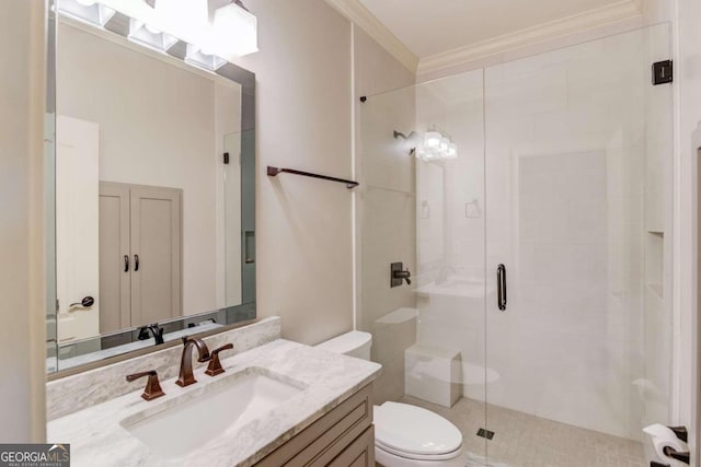 bathroom featuring vanity, toilet, an enclosed shower, and crown molding