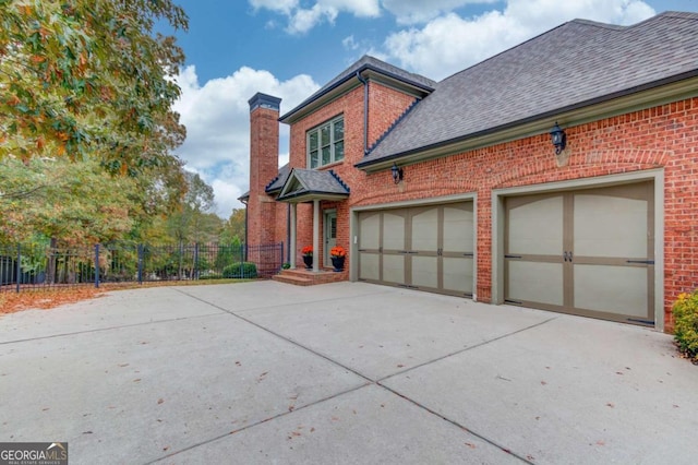 view of property exterior featuring a garage