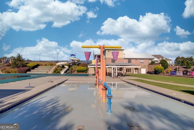 view of jungle gym with a swimming pool