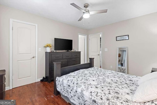 bedroom with ceiling fan and dark wood-type flooring