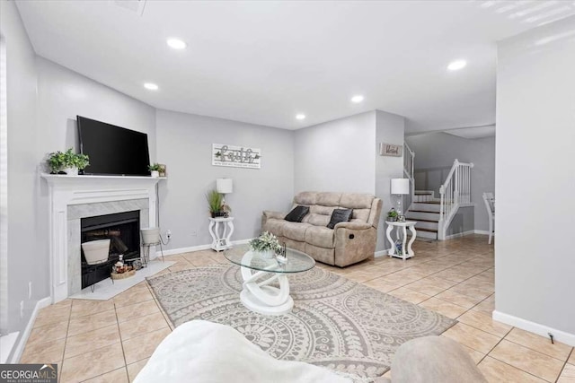 tiled living room with a high end fireplace