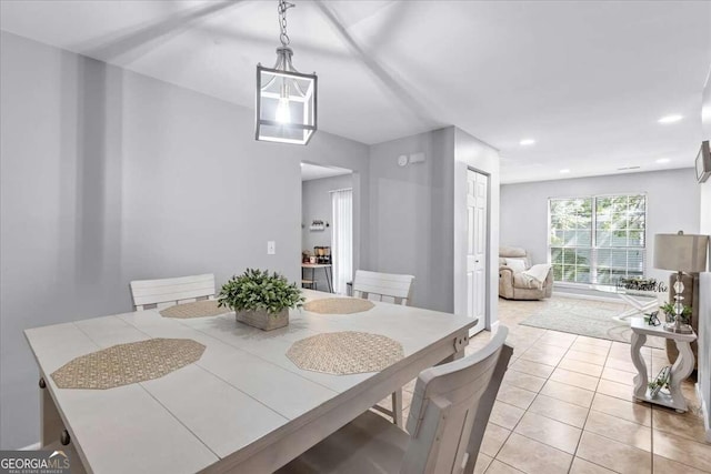 dining area with light tile patterned floors