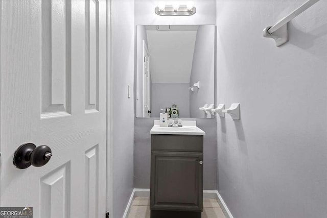 bathroom with tile patterned flooring and vanity