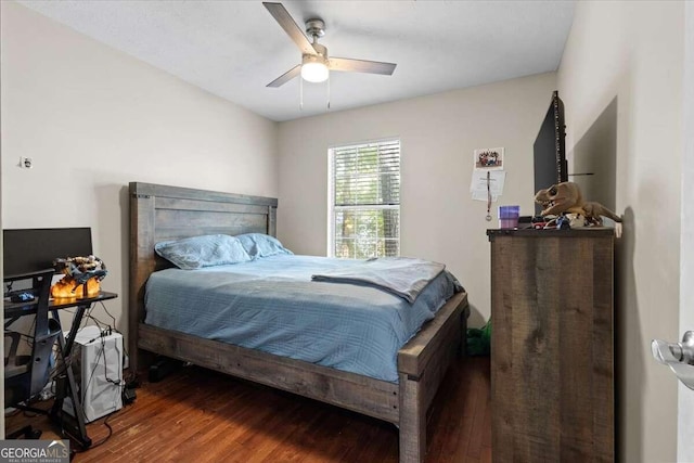 bedroom with ceiling fan and hardwood / wood-style flooring