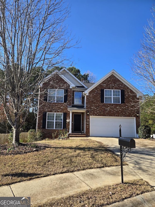 front of property with a garage