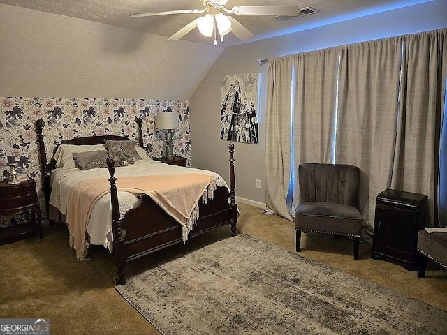 carpeted bedroom featuring ceiling fan, lofted ceiling, and a textured ceiling