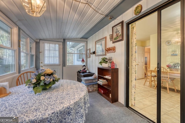 bedroom with carpet flooring and lofted ceiling