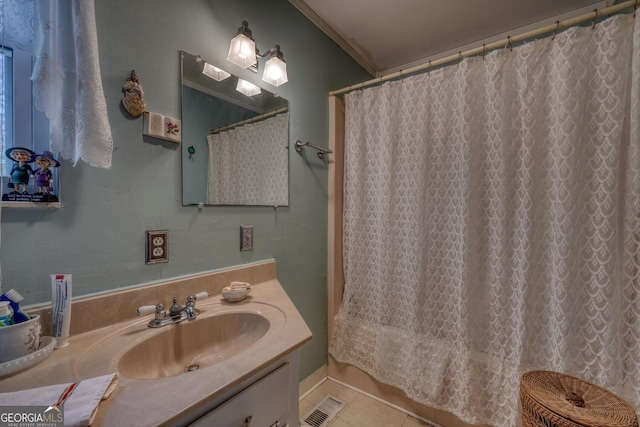 bathroom with tile patterned floors, vanity, a shower with shower curtain, and ornamental molding