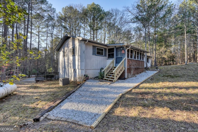 view of front of property with a sunroom