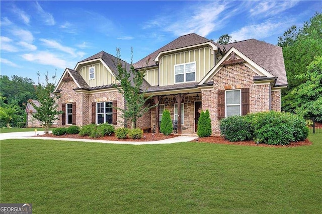 craftsman-style house with a front yard