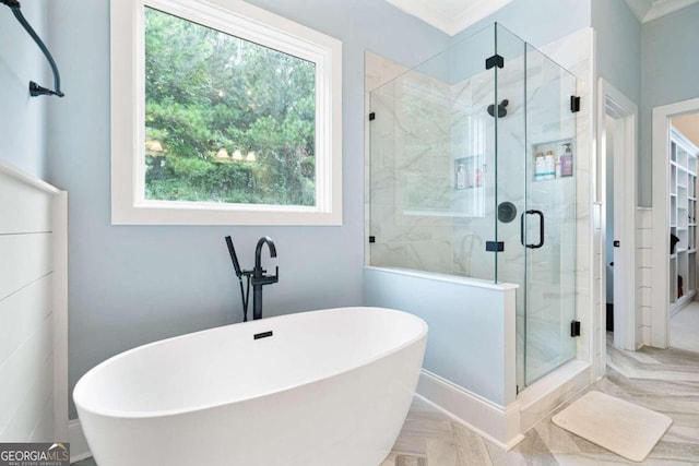 bathroom featuring plus walk in shower, crown molding, and parquet flooring