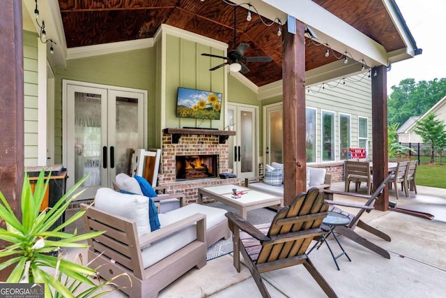 view of patio / terrace featuring an outdoor living space with a fireplace and ceiling fan