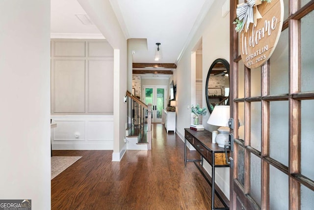 entryway featuring ornamental molding, dark wood-type flooring, and french doors