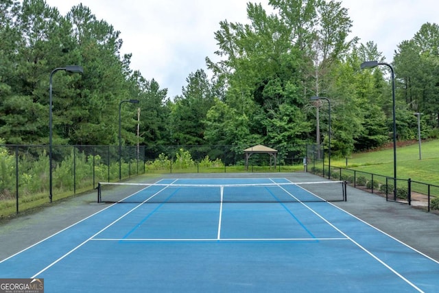 view of sport court with basketball hoop