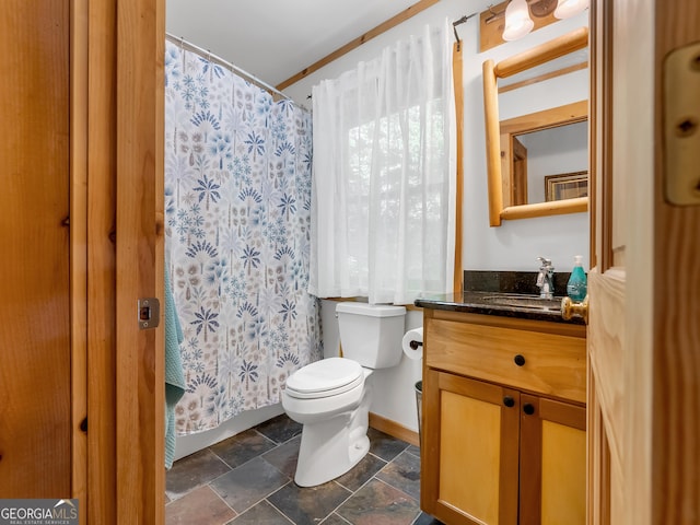 bathroom featuring vanity, toilet, walk in shower, and ornamental molding