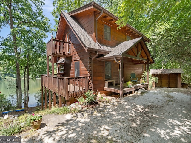 cabin with a deck with water view