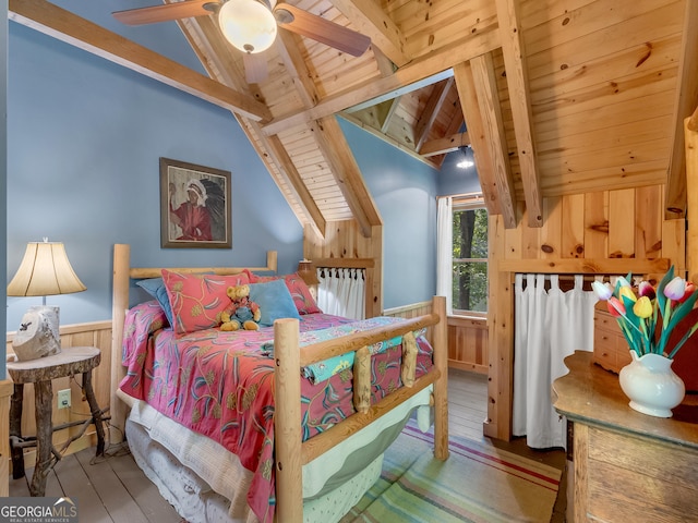 bedroom featuring wood ceiling, ceiling fan, wood-type flooring, vaulted ceiling with beams, and wood walls