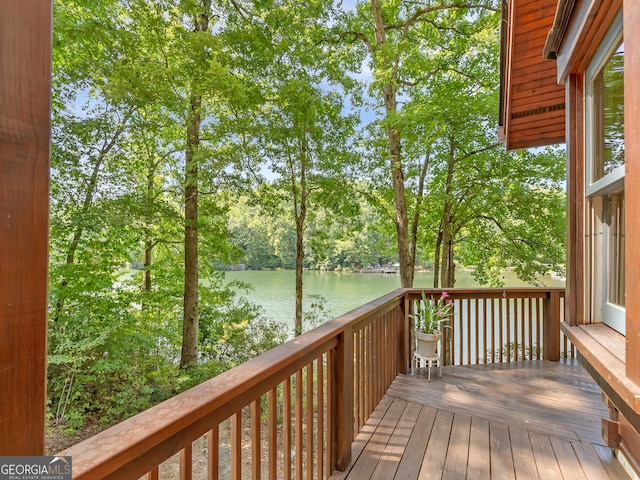 wooden deck featuring a water view