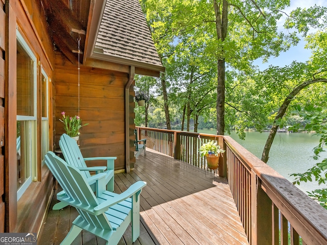 wooden deck featuring a water view