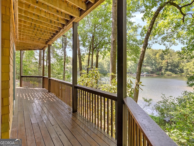 wooden terrace with a water view