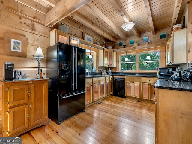 kitchen with hanging light fixtures, light hardwood / wood-style flooring, black appliances, wooden walls, and wood ceiling