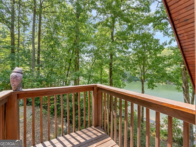 wooden deck with a water view